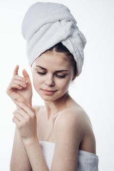 woman after shower with towel on head posing skin care. High quality photo