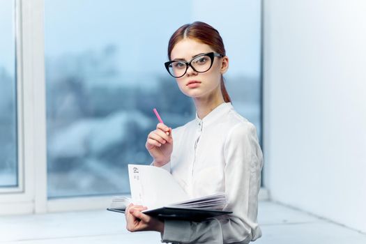 woman secretary in white shirt office work professional. High quality photo