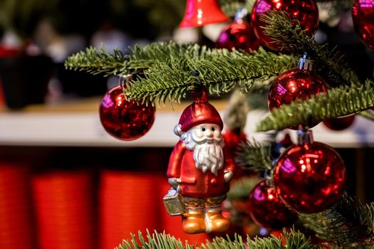 Christmas tree with blue and white toys in the interior.Christmas card