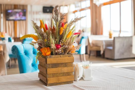 bouquet of wild flowers in the restaurant. bouquet of wild flowers in a vase. bouquet of wild flowers on the table. beautiful wild flowers.