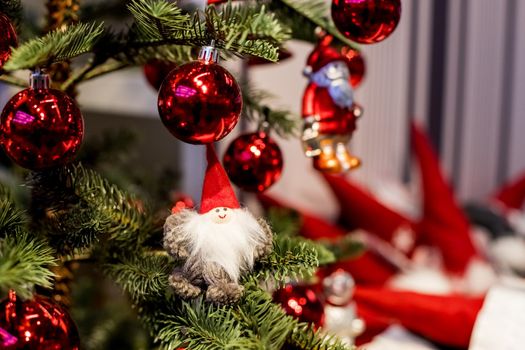 Christmas tree with blue and white toys in the interior.Christmas card