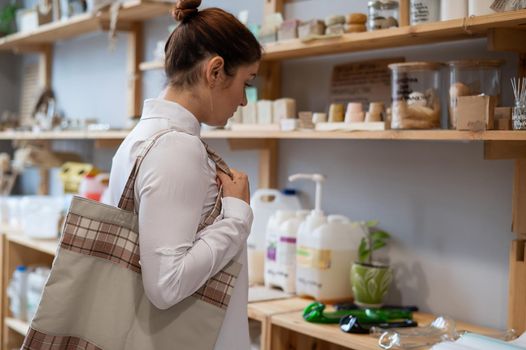 Caucasian woman in eco store zero waste plastic