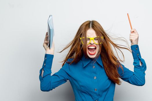 business woman with notepad and pencil wearing yellow glasses office professional. High quality photo
