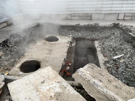 Repair of the heating main. The underground pipe through which steam flows is damaged.