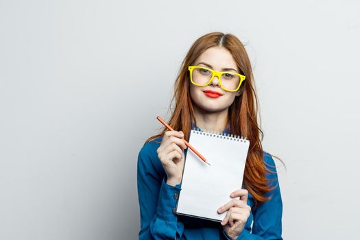 woman secretary with yellow glasses notepad work official. High quality photo