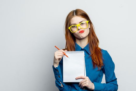 woman secretary with yellow glasses notepad work official. High quality photo