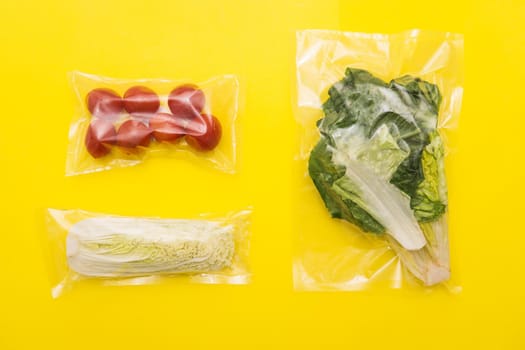 Salad dinner set: lettuce, tomatoes, peking cabbage, A set for delivering food for dinner on a yellow background. I cook at home. Ingredients for veggie vegetable salad.