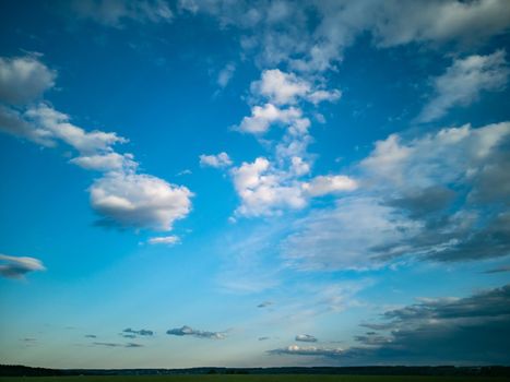 beautiful countryside landscape. deep blue sky with white clouds in daylight
