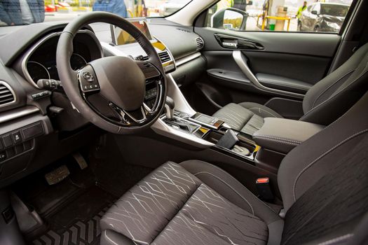 empty interior of modern premium car. black interior, driver's seat. no people