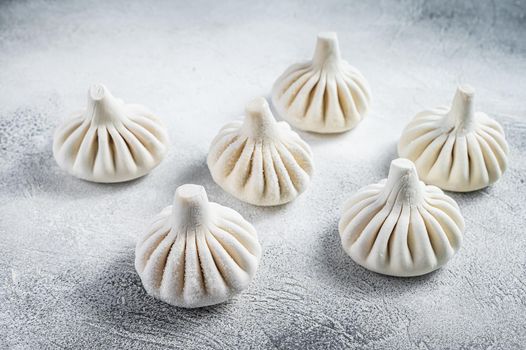 Georgian Raw dumpling Khinkali with meat. White background. Top view.