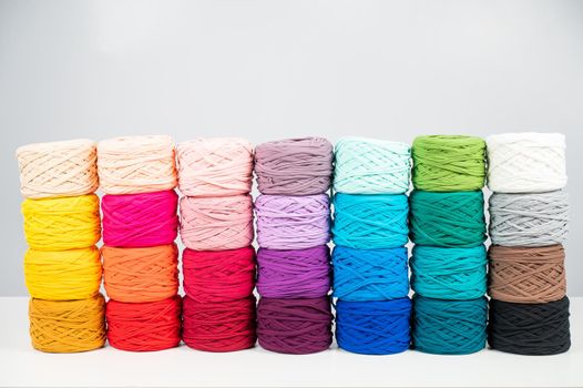 Rows of multicolored cotton yarn. The assortment of the store for needlework