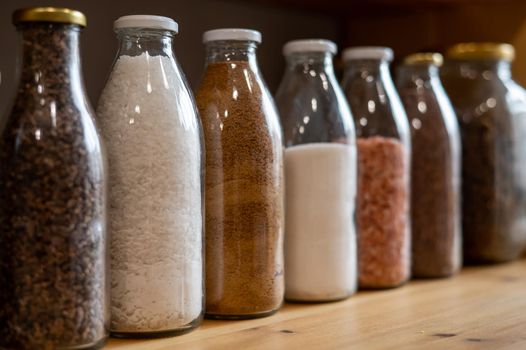 Glass jars with cereals in an eco friendly store. The concept of a grocery store without plastic disposable packaging.