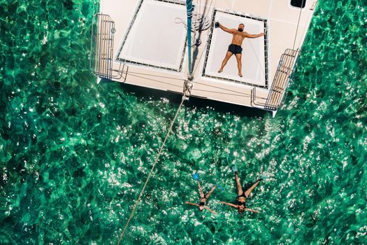 young handsome man lies on a yacht in the indian ocean.mauritius island.