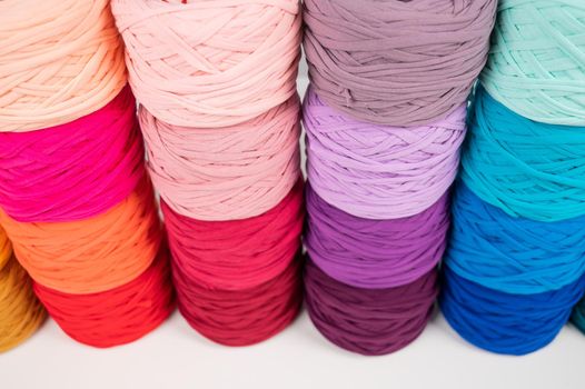 Rows of multicolored cotton yarn. The assortment of the store for needlework