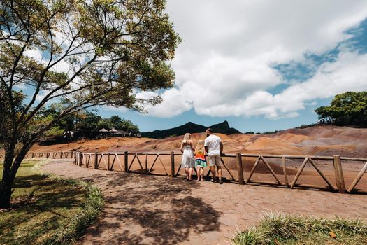 family against the background of seven-Colored lands in Mauritius, nature reserve, Chamarel Sands.Mauritius island.