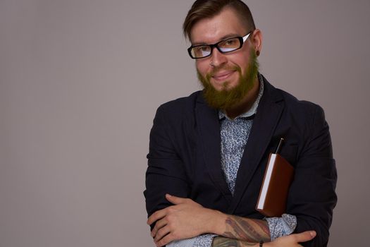 business man with glasses with tattoos on his arms office professionals. High quality photo