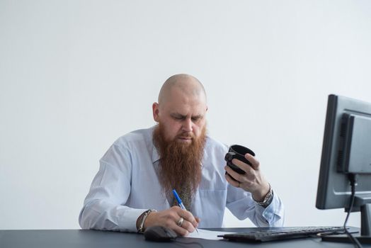 Problems for the office worker. A bald man in a white shirt sits at a desk with a computer and is stressed because of failure. A nervous breakdown