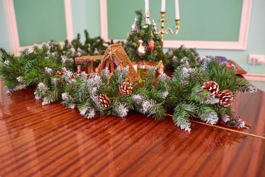 Christmas figurines surrounded by fir branches