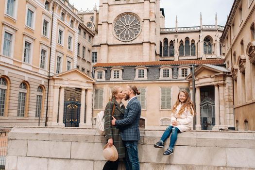 A beautiful family with strolls through the old city of Lyon in France.Family trip to the old cities of France.