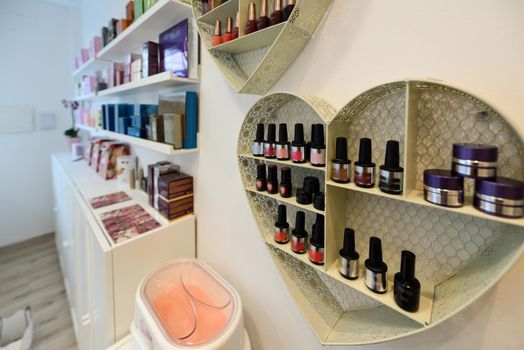 Cosmetic section with nail polish, facial cream, conditioners, shampoo and hair treatment in store