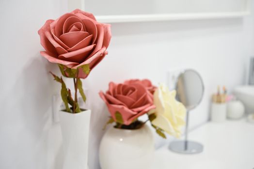 Decoration details in modern wellness center with flower vase and candles. Beauty and Aesthetic concepts.