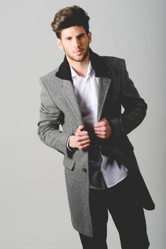 Portrait of handsome man wearing coat