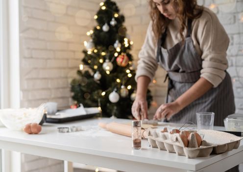 Merry christmas and happy new year. Smiling woman in the kitchen baking christmas cookies