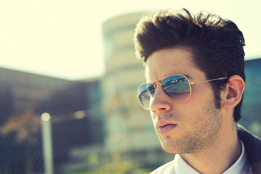 Portrait of a handsome young man with sunglasses