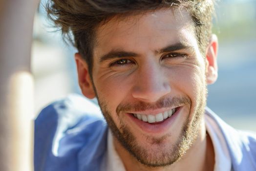 Close up of young man smiling outdoors