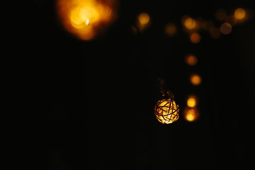 Christmas lights on dark background. Ball shaped. .