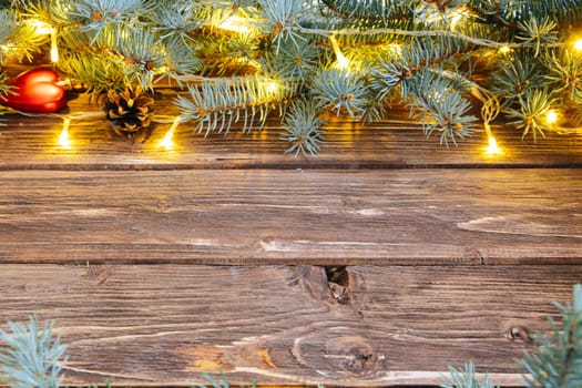 Brown wooden background with festive Christmas decoration, copy space .