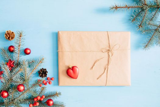 Christmas wooden background with snow fir tree and gift box. View with copy space .