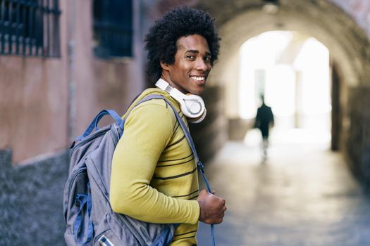 Cuban Black man with afro hair sightseeing in Granada, Andalusia, Spain.