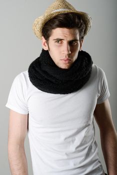 Portrait of handsome man wearing hat and scarf