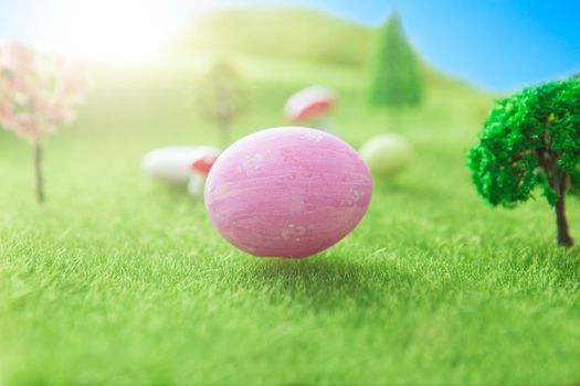 Easter egg hunt with pink colored egg in a Dreamland or fairy world. .