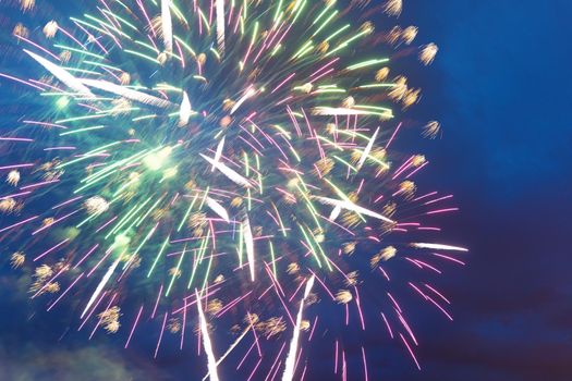 Brightly colorful fireworks and salute of various colors in a night sky. Independence Day, 4th of July, Fourth of July or New Year.