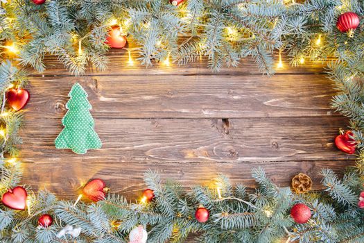 Christmas wooden background with xmas tree from textile .