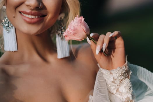 Red rose in the hands of the bride.