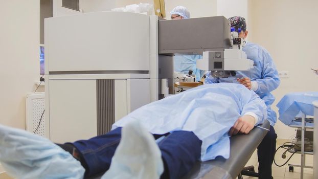 Medical patient on the operating table - laser vision correction - ophthalmology surgery, close up