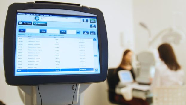 Ophthalmologist in eyes clinic doing diagnostic with vision of patient by modern computer systems - high technology health care, close up