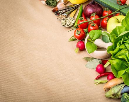 Fresh vegetables on a brown background