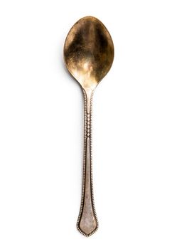 Old metal spoon isolated on a white background