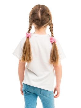 little girl in white t-shirt stands, back against a white background
