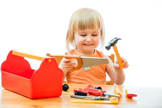cute little kid with toy tools isolated on a white background