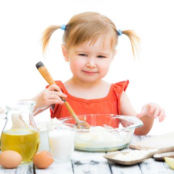 funny little baby girl baking isolated on a white background