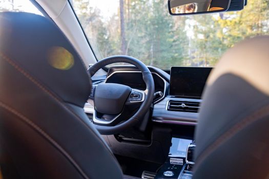 empty modern car interior. empty driver's seat in a premium modern car. steering wheel