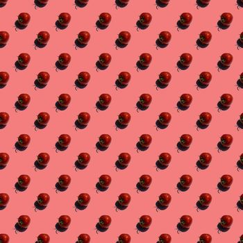 Pattern with many tomatos on red background