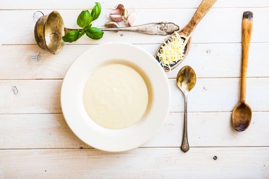 onion soup puree in a white plate on the table