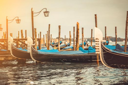 beautiful gondolas in a canal in Venice, Italy