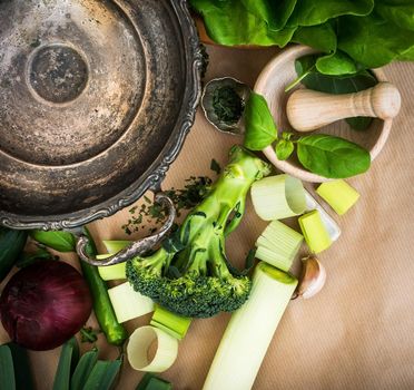 Fresh vegetables and old metal bowl